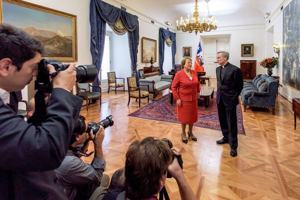 President Michelle Bachelet of Chile greets University of Notre Dame President Rev. John I. Jenkins, C.S.C. at La Moneda Presidential Palace